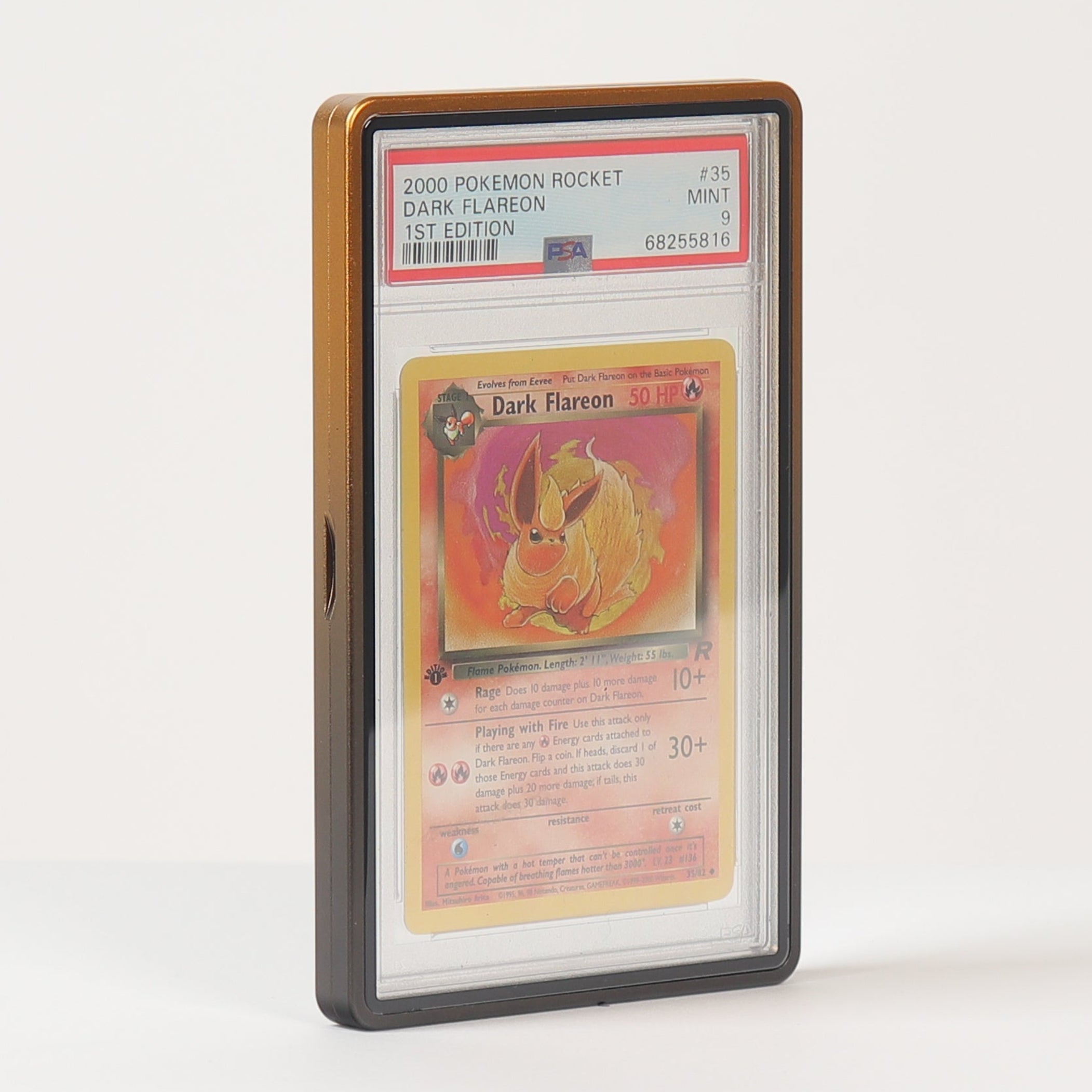 A graded 2000 Pokémon Rocket Dark Flareon 1st Edition trading card, mint condition, encapsulated in a PSA grading slab and displayed inside a clear protective case with a brown wooden frame, set against a plain white background.