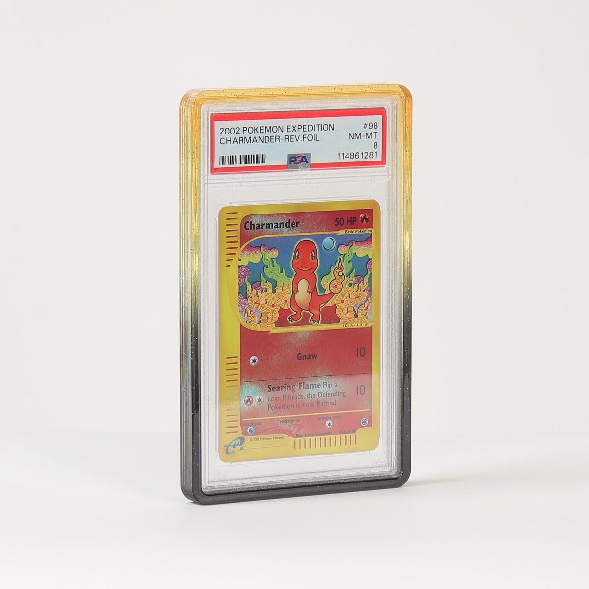 A graded holographic Pokémon TCG card, specifically a 2011 Charizard hologram, encapsulated in a PSA grading sleeve and standing upright on a white surface against a white background.