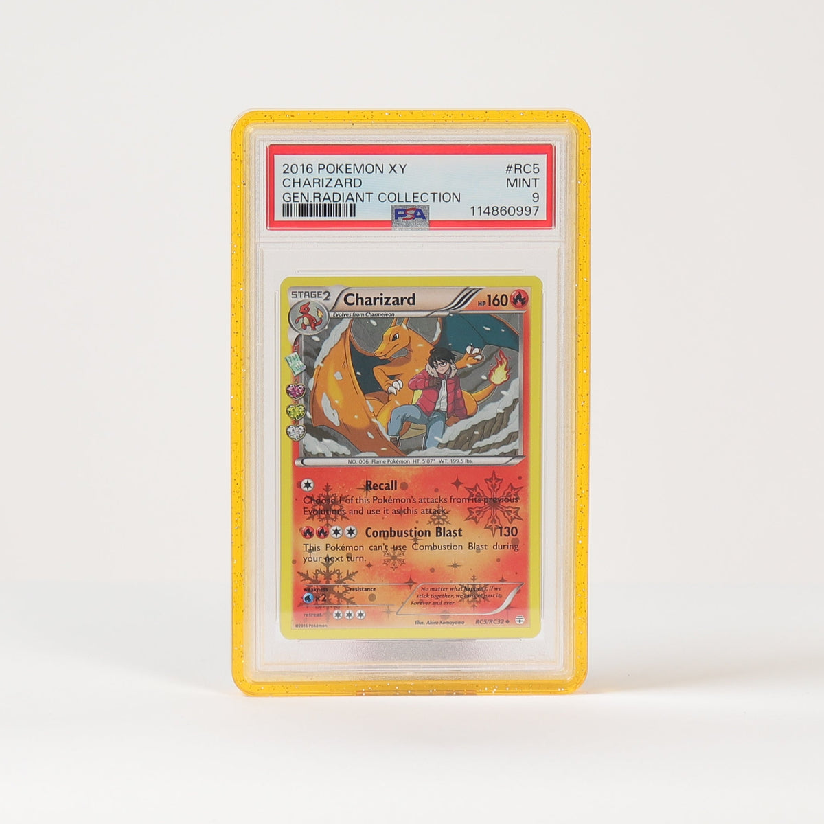 A graded Pokémon TCG card in a clear plastic slab with a yellow border, standing upright on a white surface against a white background.