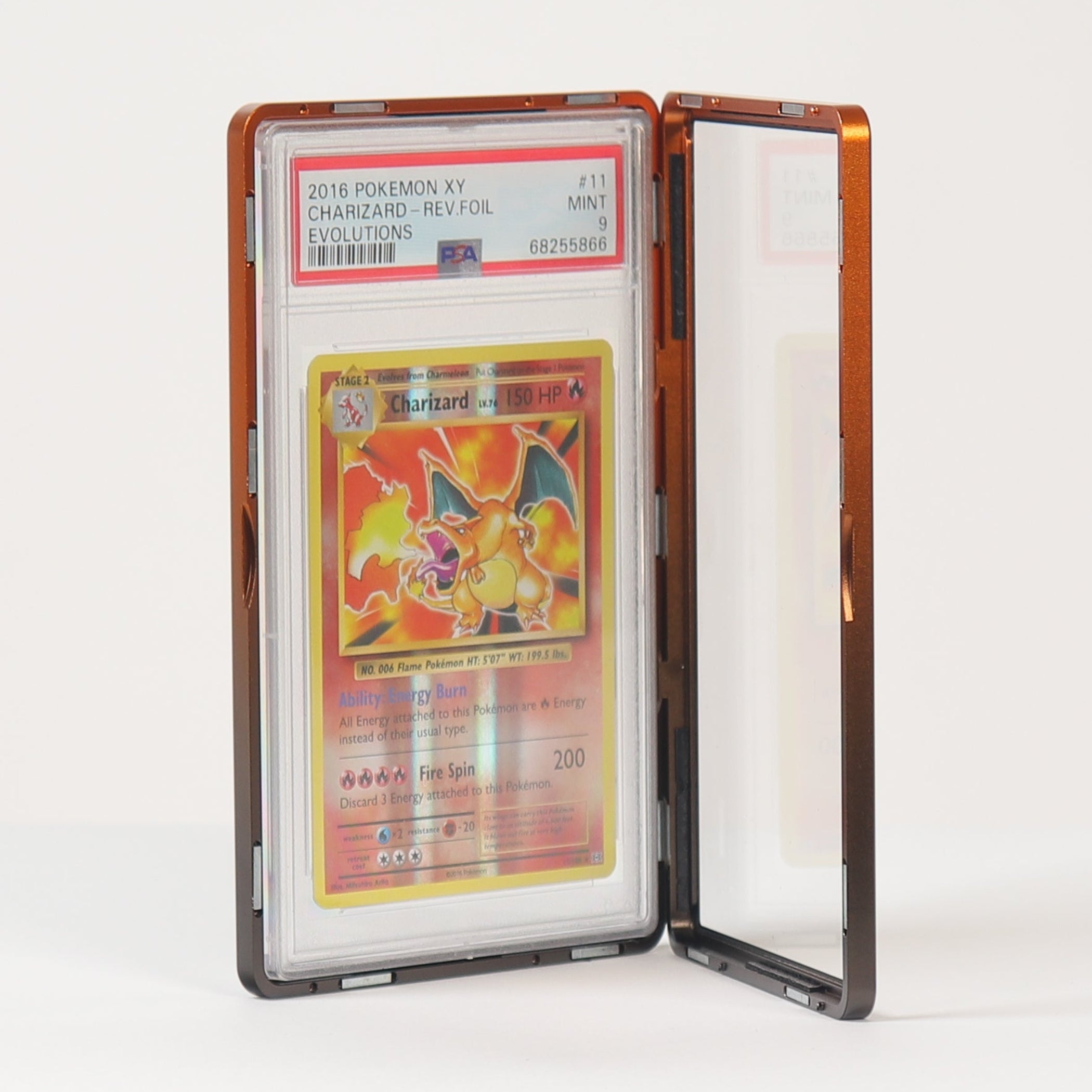 A graded collectible card in a clear aluminium grading case, standing open on a white surface against a white background.